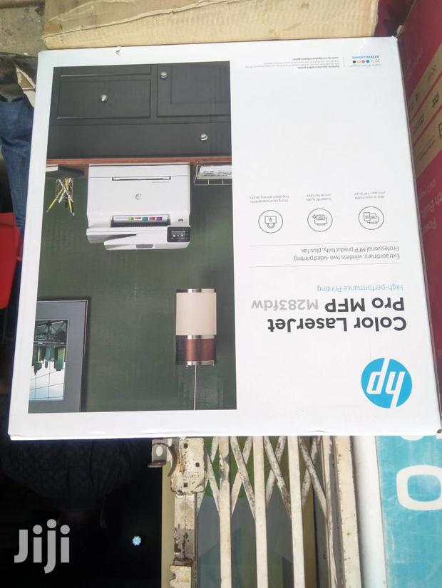 At HP Colour Pro M283fdw Multi-Function Printer ( · Photo 2