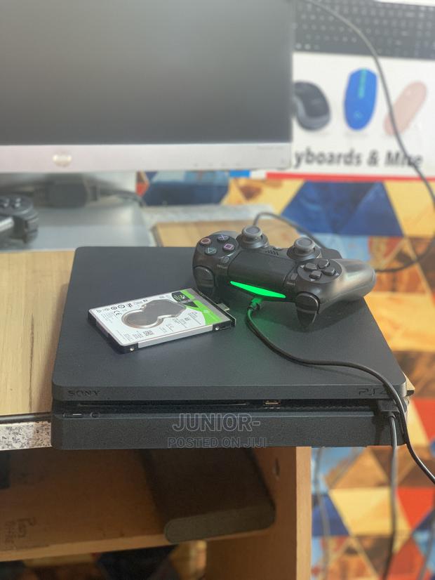 Neat Playstation 4 Slim With Games · Photo 3