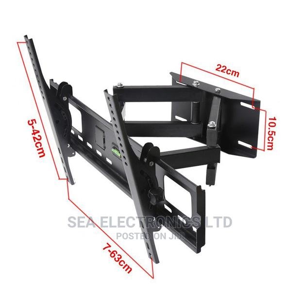 Universal Design Fits Most 32" - 65" TV. · Photo 1