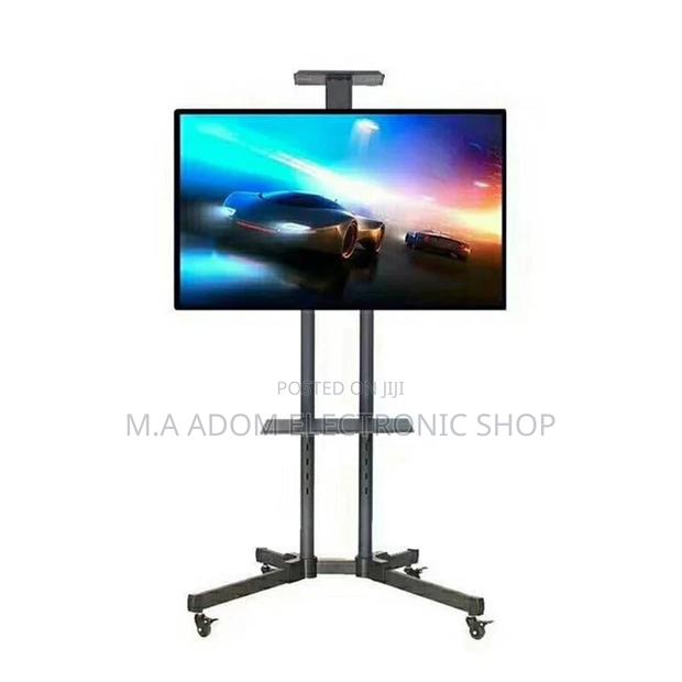 Modern Tv Stand on Wheels Rolling Tv Cart 32”-70” · Photo 2