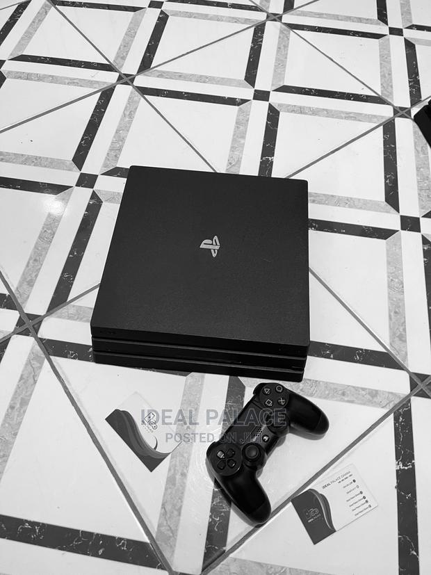 Black Ps4 Pro With 5 Games · Photo 3