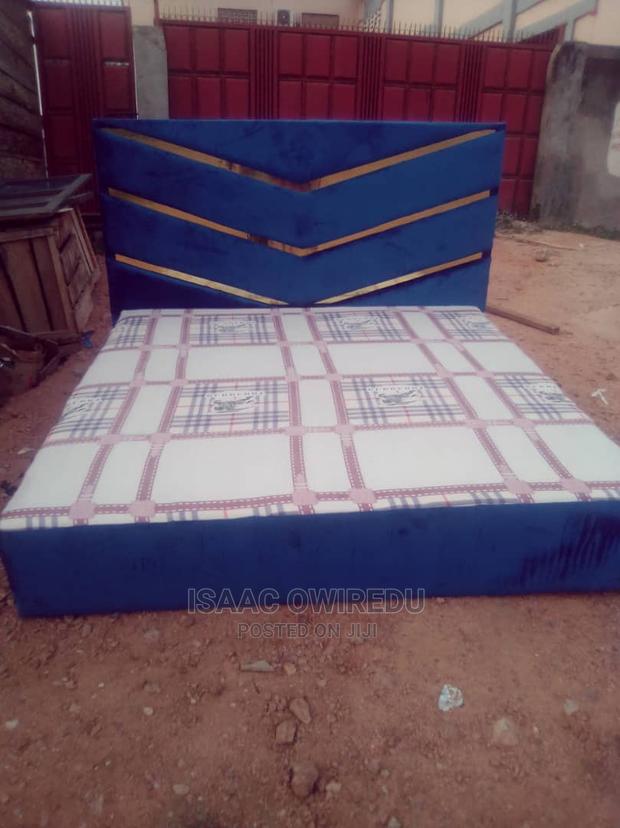 Wooden Bed Covered With Foam and Materials
