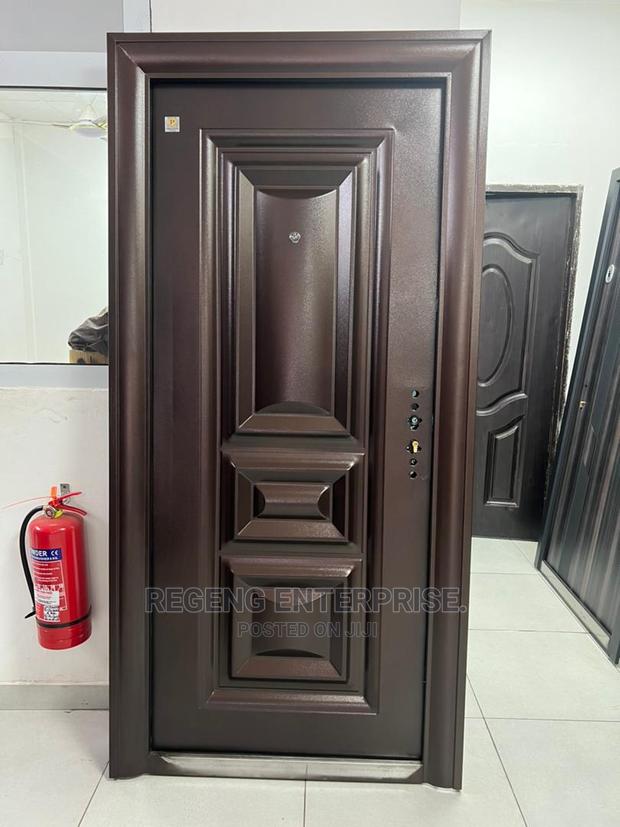 Brown Metal Single Security Door With Accessories · Photo 2