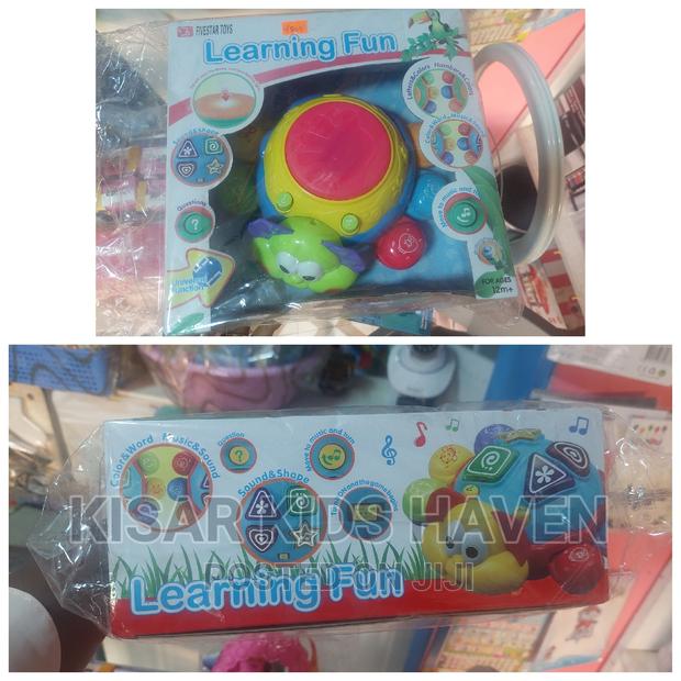 Kids Learning Toy(
Sound and Shape
Letters and Colours
Music · Photo 2