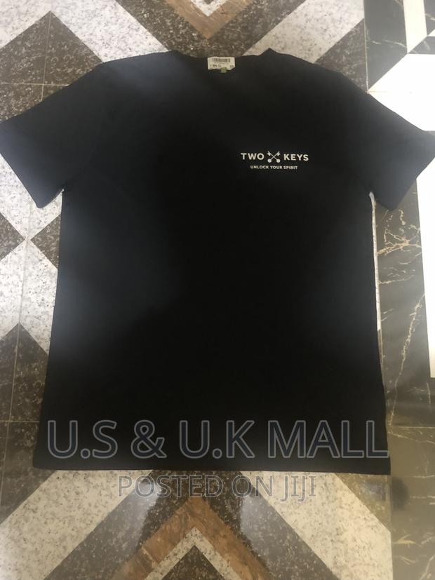 Large Black T- Shirts and Cap From America in Stock photo 4