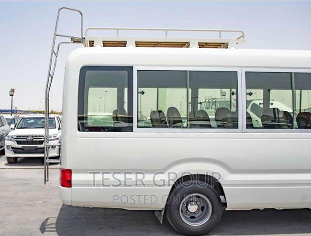 New Toyota Coaster 2023 Beige photo 4
