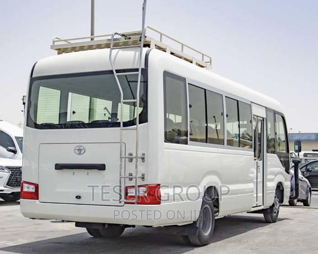 New Toyota Coaster 2023 Beige photo 3