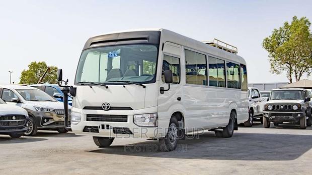 New Toyota Coaster 2023 Beige photo 2