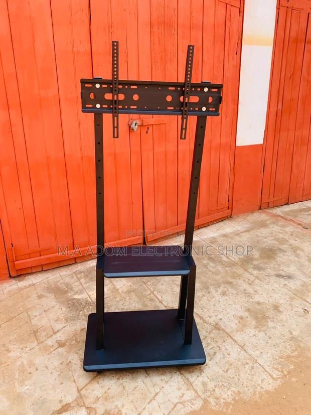 Affordable Mobile Tv Stand With Wheels for 32”-75” Tv · Photo 2