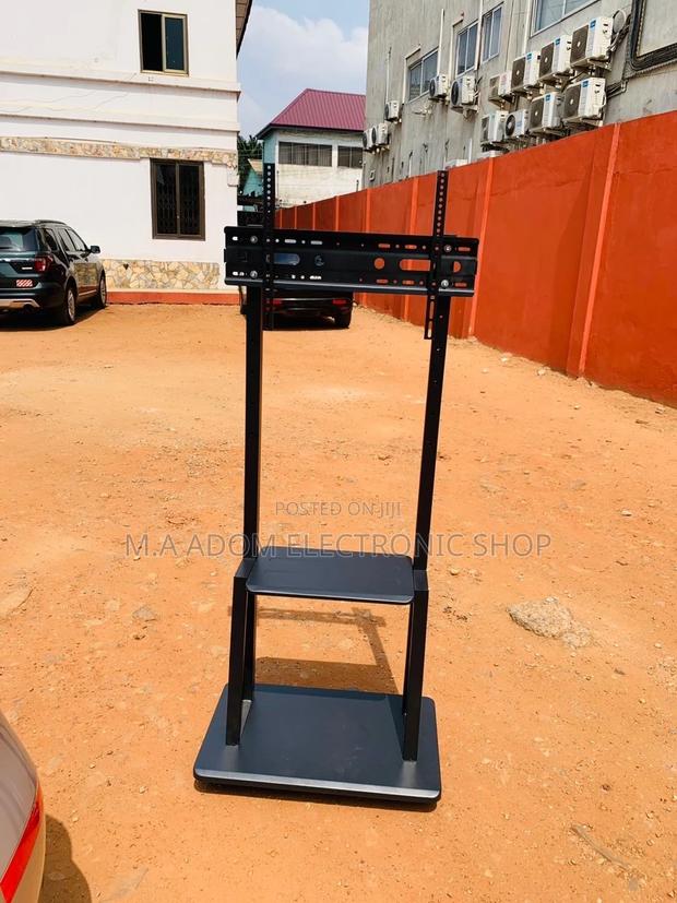 Durable Mobile Tv Stand With Wheels for 32”-75” Tv · Photo 2
