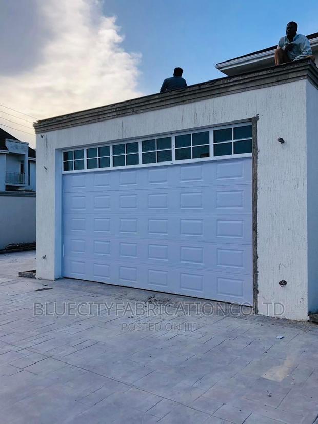 American Automated Garage Door and Fanlight on Top 16ft X8ft · Photo 4