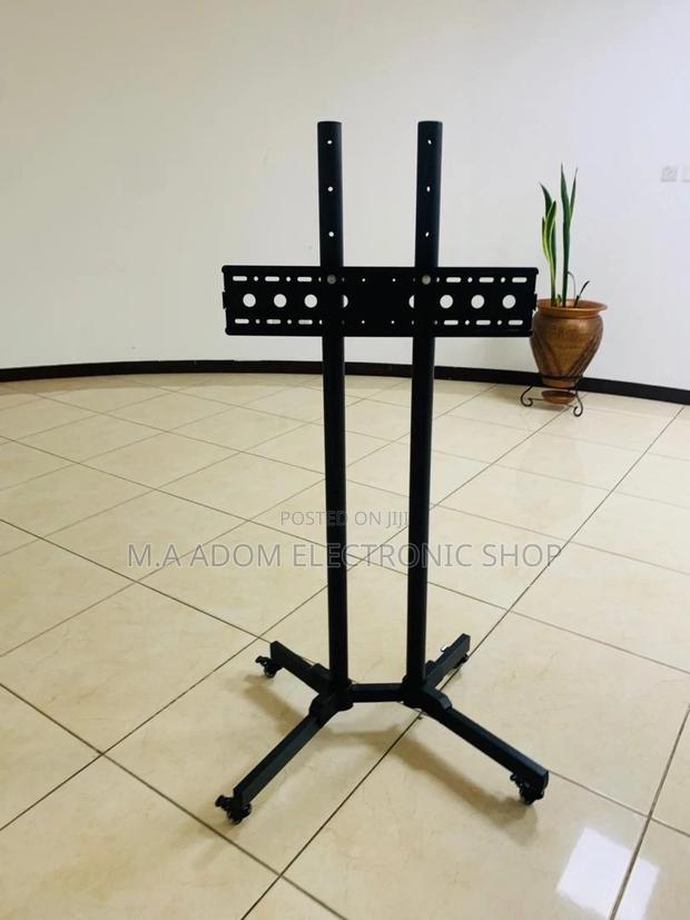 Well Design Moveable Tv Trolly for 32” to 70”(Black). · Photo 2
