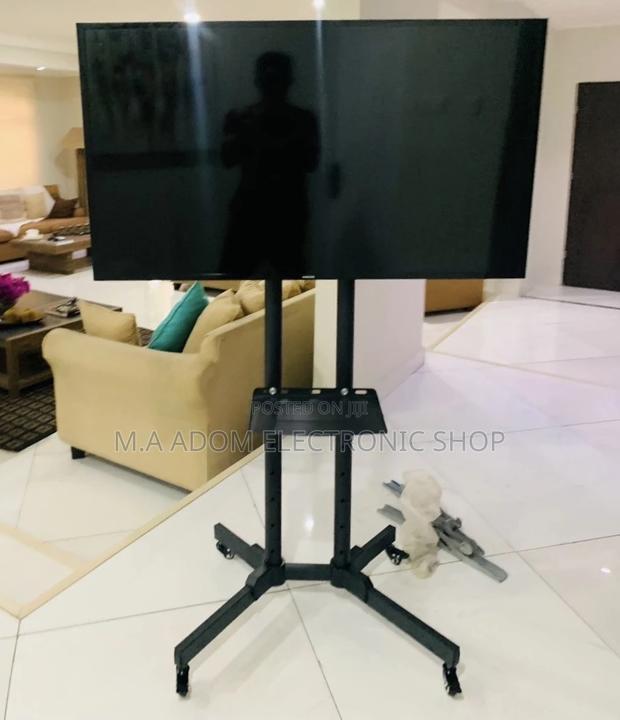 (Black)Purchase Moveable Tv Trolly for 32”-70” Tv. · Photo 2