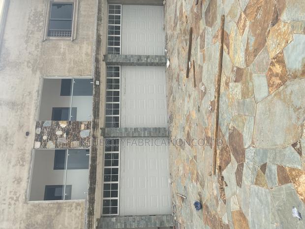 American Triple Automatic Garage Doors · Photo 3