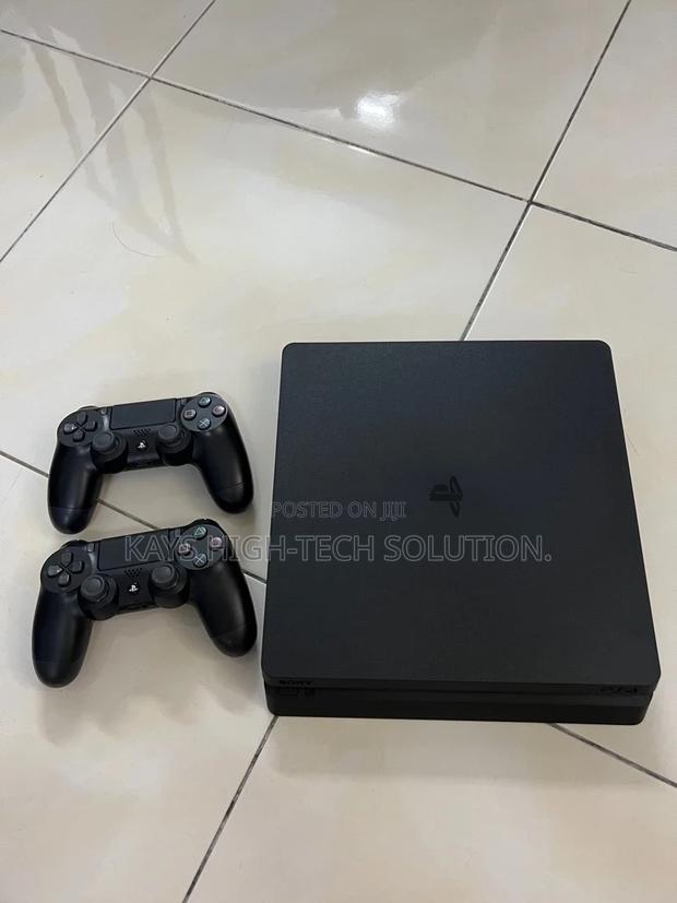 Playstation 4 Slim With 2 Controllers and New Games · Photo 4