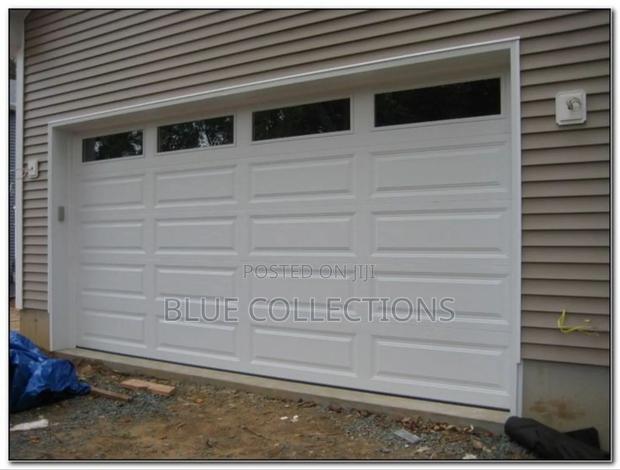 18 ×8 Automated Garage Door With Fanlight and Remote · Photo 2