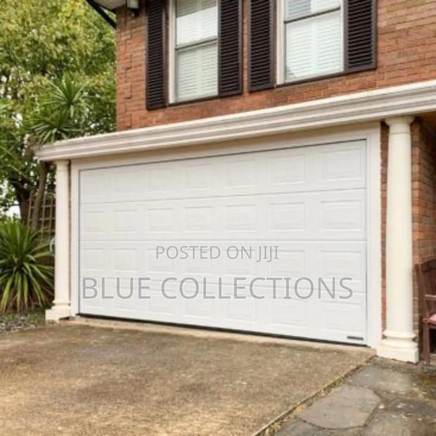 12×8 Foreign Automated System Garage Door · Photo 2