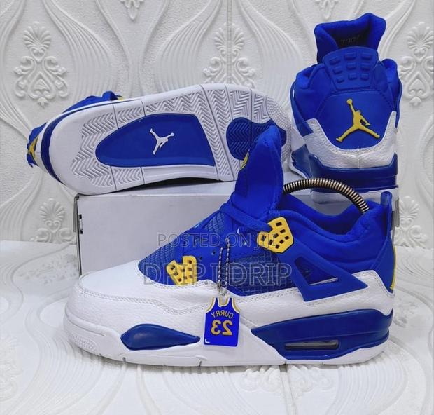 Air Jordan 4 Rethro Blue and White With Touches of Yellow · Photo 4