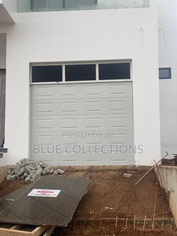 9×8 Automated Garage Door With Fanlight · Photo 3