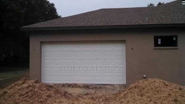 12×8 Automated Garage Door With Remote · Photo 2