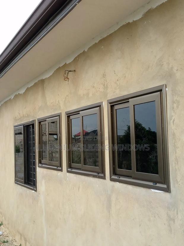 Aluminium Sliding Windows With Dark Tinted Glass and Net photo 3