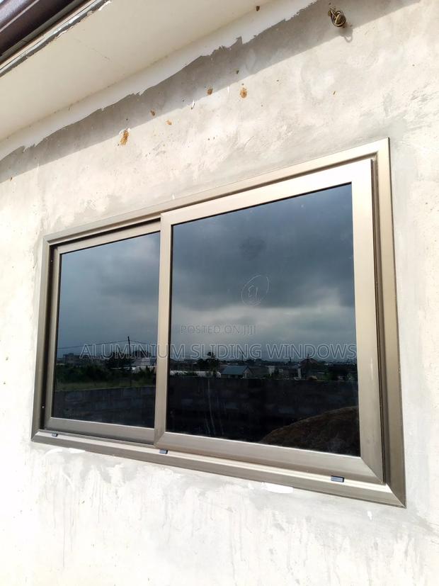 Aluminium Sliding Windows With Dark Tinted Glass and Net photo 4