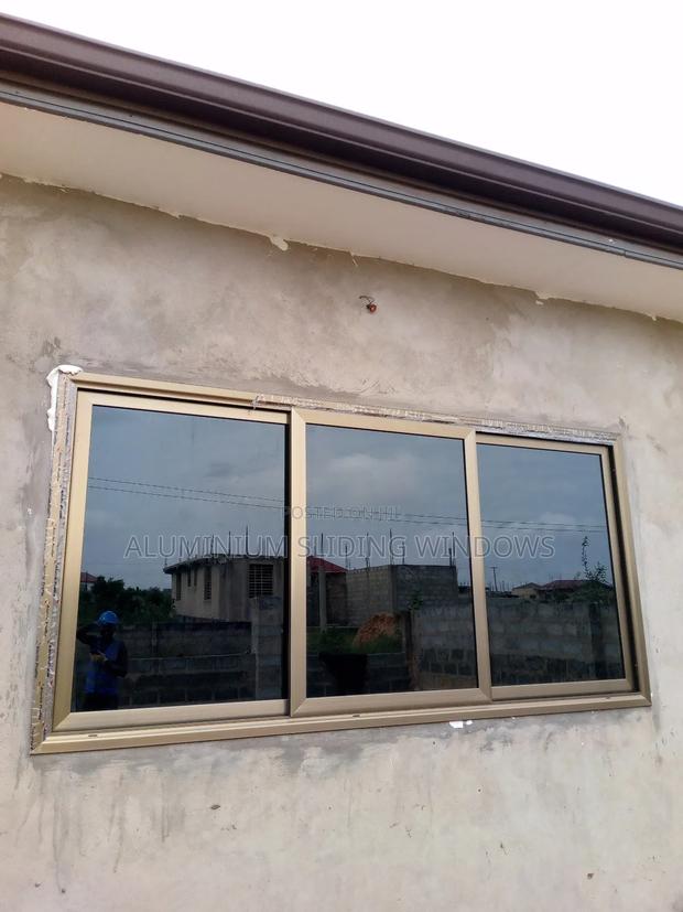 Aluminium Sliding Windows With Dark Tinted Glass and Net photo 5