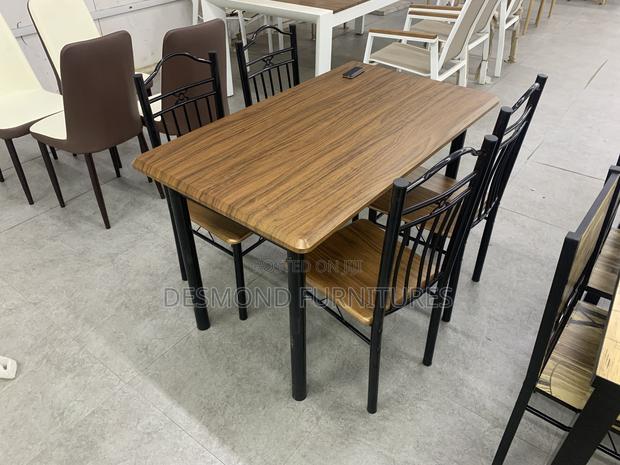Wooden Dining Table With 4 Chairs · Photo 1