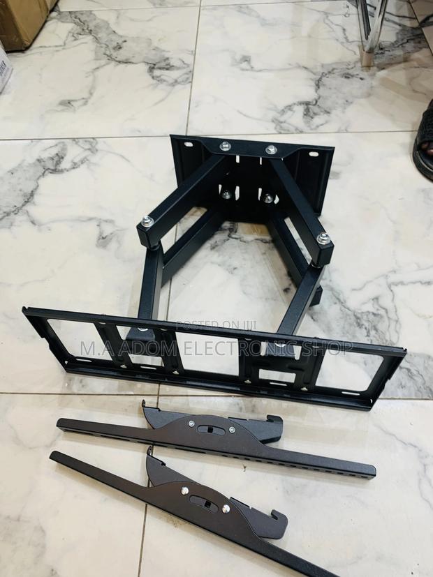 Adjustable Tv Wall Mount for a Solid View 33”-80” · Photo 3