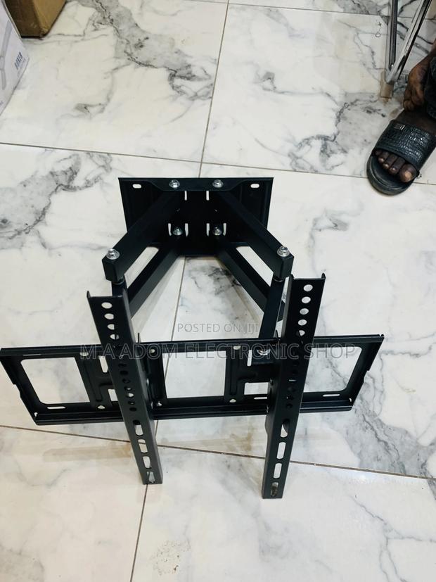 Adjustable Tv Wall Mount for a Solid View 33”-80” · Photo 4