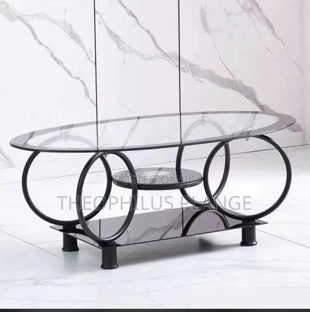 Glass Center Table With Round Base Design. · Photo 1