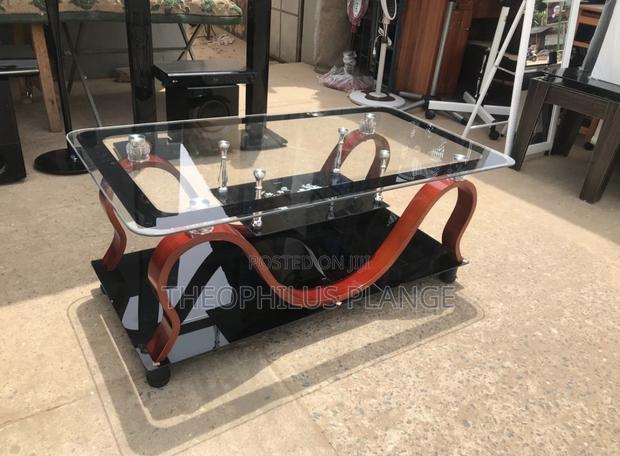 Glass Center Table With Red and Black Ceramic Design Base · Photo 1