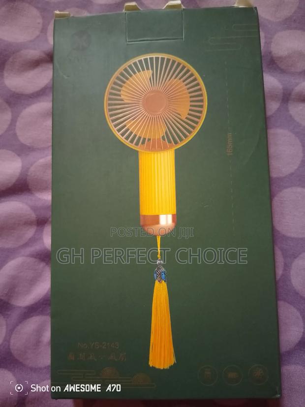 Mini Cooling Device - Hand Fan · Photo 1