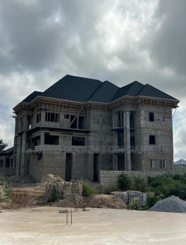 Shingles Roofing and Concrete Parapet · Photo 3