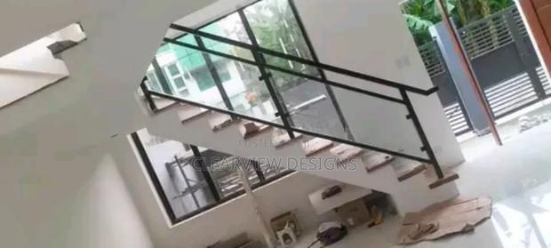 Safe Glass and Metal Stair Railing · Photo 2