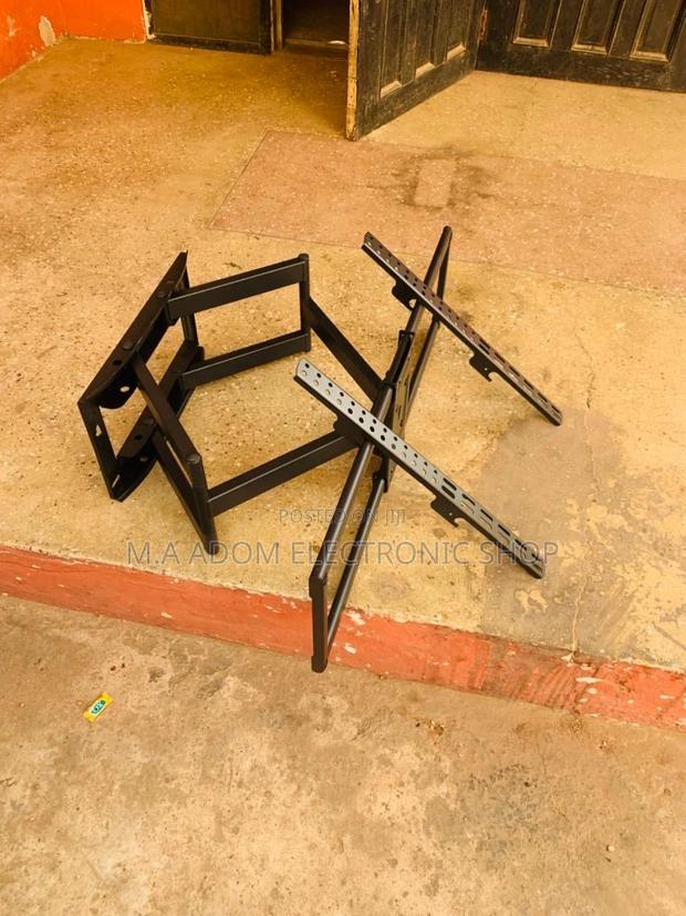 Space-Saving Viewing Solution:Adjustable 32”-70” TV Mount · Photo 2