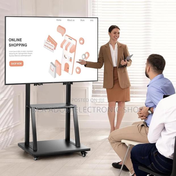 Mobile TV Stand: 32"-75" Tvs, Roll With Ease · Photo 2