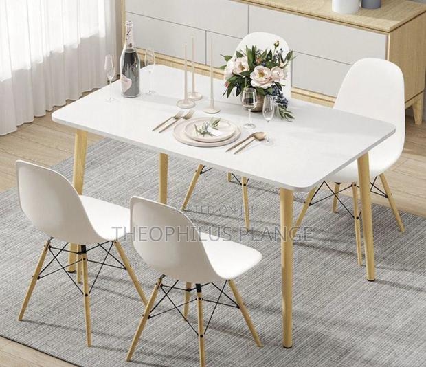 White Dining Table Set With 4 Nordic Chairs · Photo 2