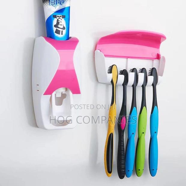 Automatic Toothpaste Dispenser and Toothbrush Holder Set · Photo 2