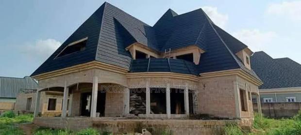 Parapet Design and Roofing Sheet Installation · Photo 2