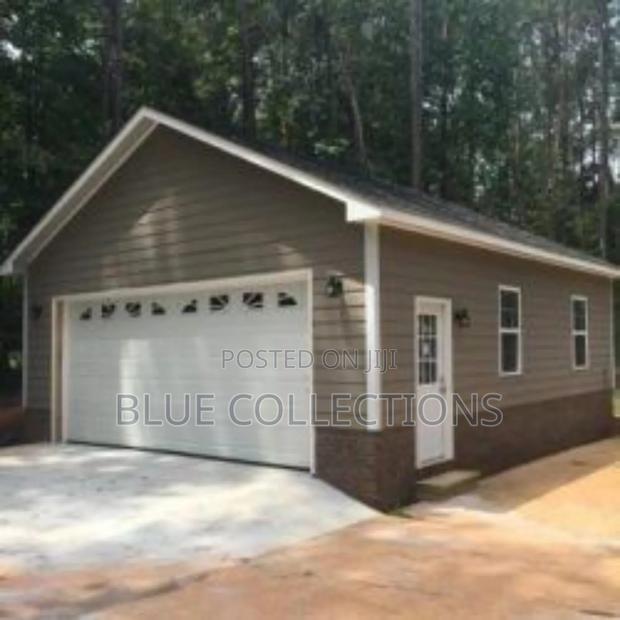 Smart Home Garage Door With Arch Fanlight · Photo 2