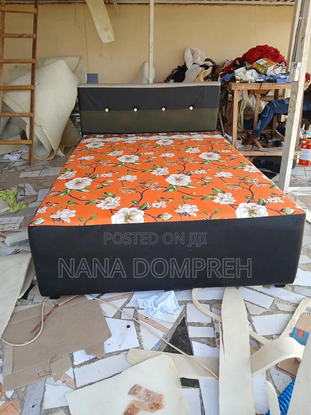 Orange on Black Bed