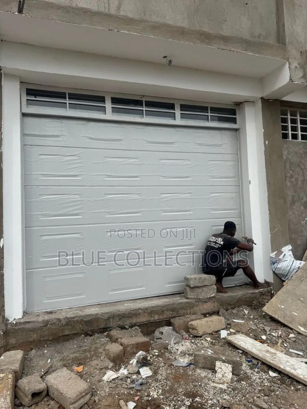 Automated Garage Door With Fanlight · Photo 4