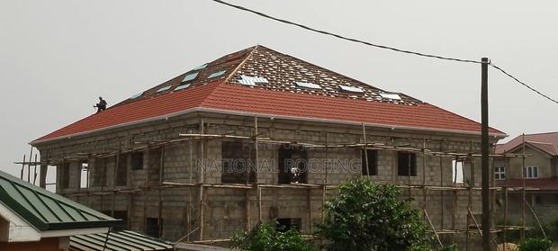 Installation of Rain Gutter and Stone Coated Roofing Sheet.