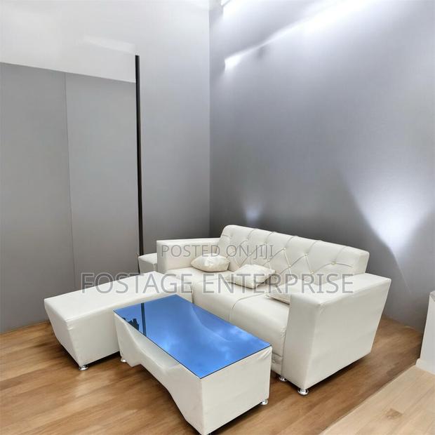 Neatly Designed Duarble Sofa With a Centre Glass Table · Photo 2