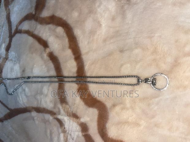 Fist With Ring Long Necklace · Photo 4