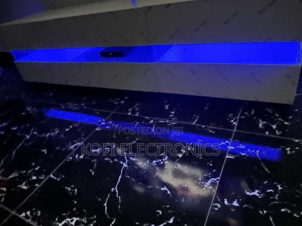 An Affordable High Gloss Tv Stand in White With Led Lighting · Photo 3