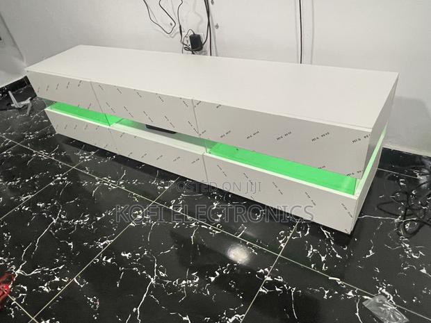 An Affordable High Gloss Tv Stand in White With Led Lighting · Photo 4