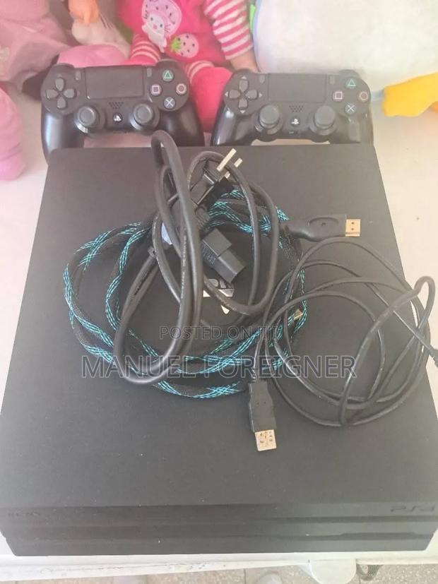 Ps4 Pro With Controller and Games · Photo 2