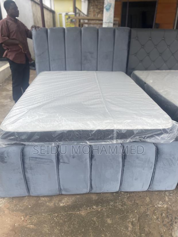 A Double Standard Bed Frame With Mattress · Photo 2